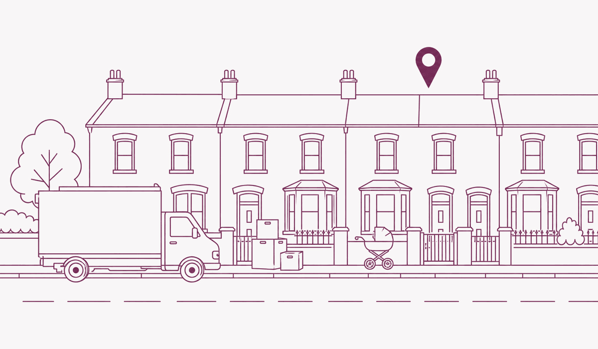A removal van outside a terraced street, boxes and a pram on the pavement, one house pinned